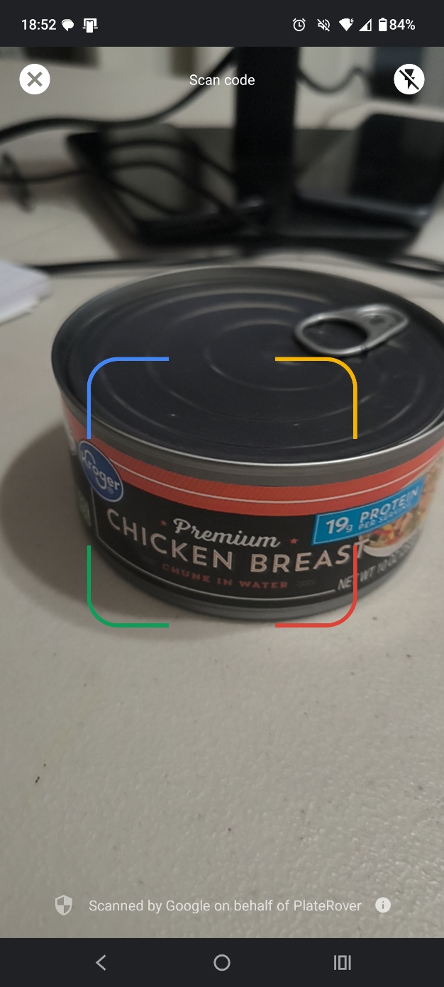 PlateRover barcode scanner framing the code area on a packaged can of chicken
